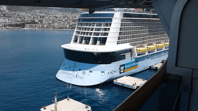 Odyssey of the Seas docked at Kuşadası cruise port, the town behind her