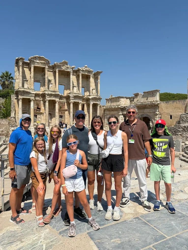 Our licensed guide İbrahim Pancar with an American family of Celebrity Infinity guests at the Library of Celsus on a private Biblical Ephesus tour from Kuşadası port, 4 August 2026