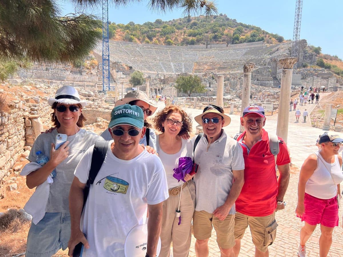Celebrity Xcel guests with the 24,000-seat Great Theatre of Ephesus behind them on a private tour from Kuşadası port, 13 August 2026