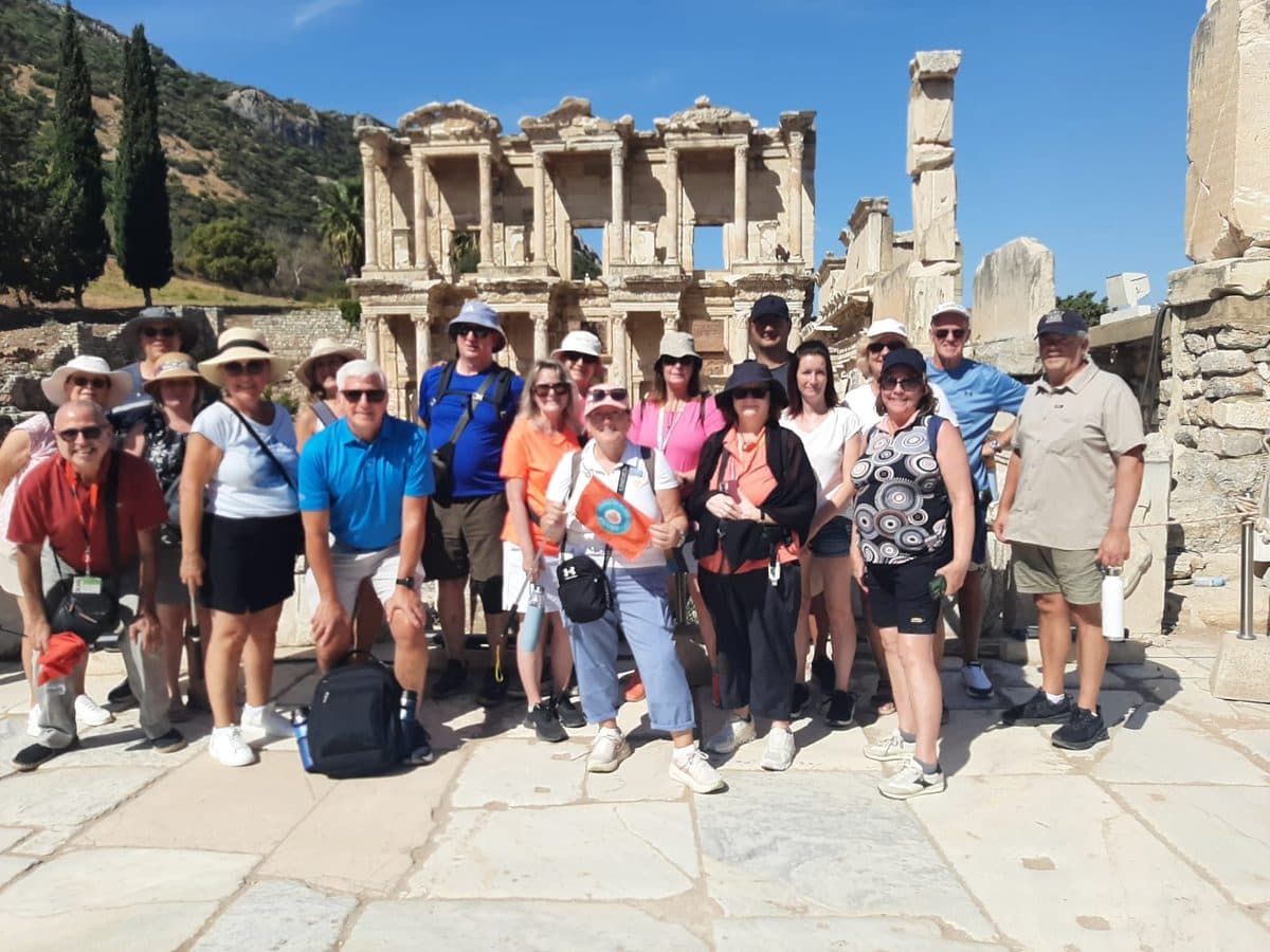Our French-speaking licensed guide Eli Halegua with a large group of Celebrity Infinity guests on a private Ephesus tour, on the marble plaza in front of the Library of Celsus, 13 September 2026