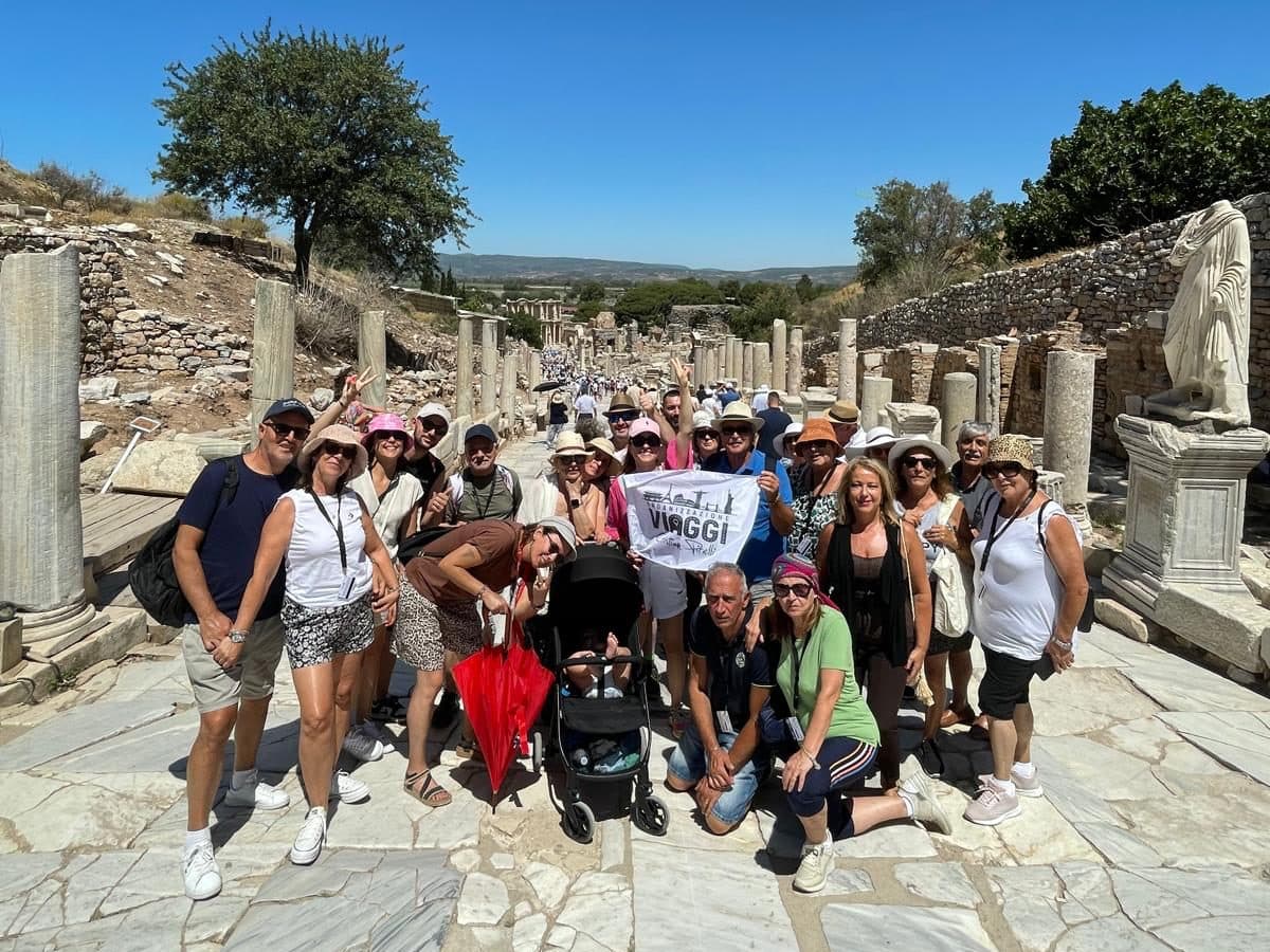 Tour group on Curetes Street in Ephesus with the Library of Celsus at the foot of the street