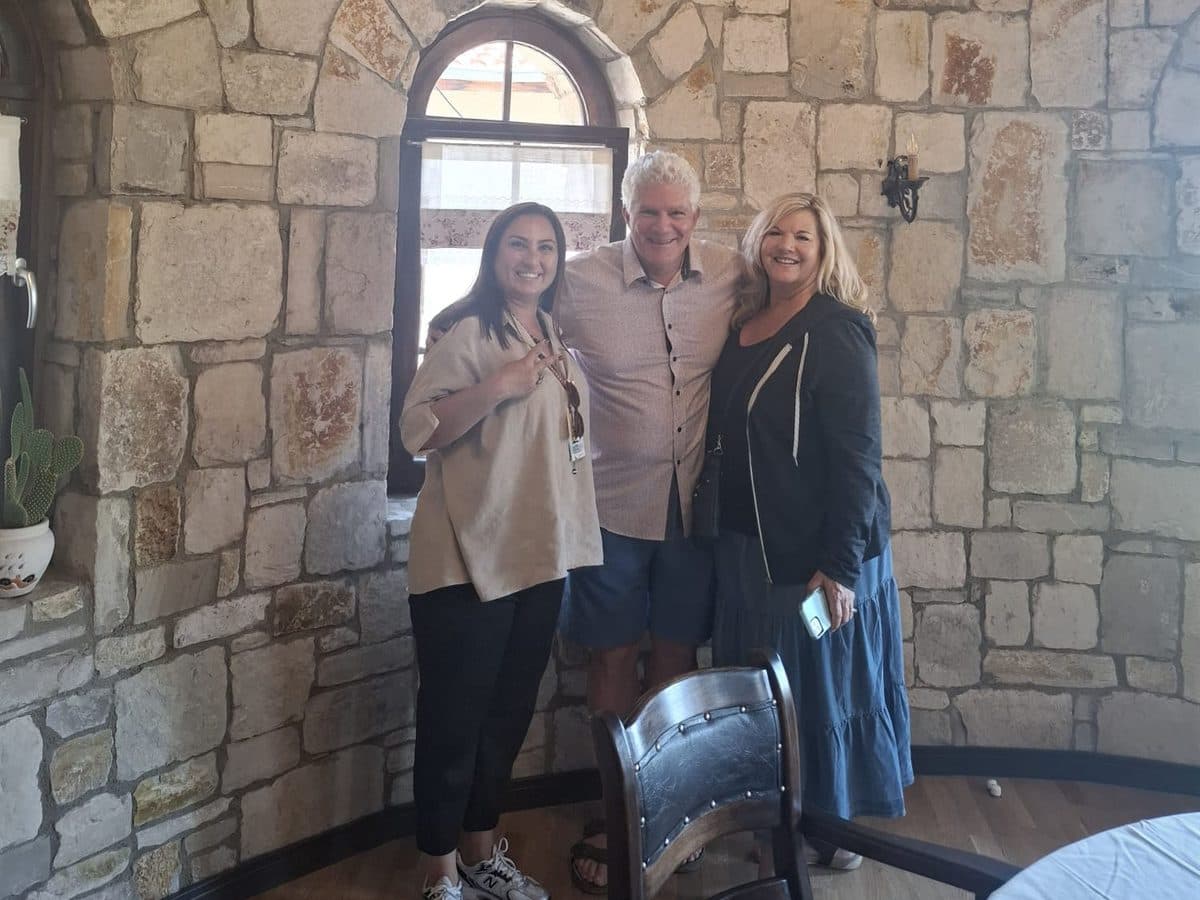 Tours of Ephesus guide Fulya Tamer with two guests inside the stone-walled Yedi Bilgeler wine house near Ephesus, 18 July 2026