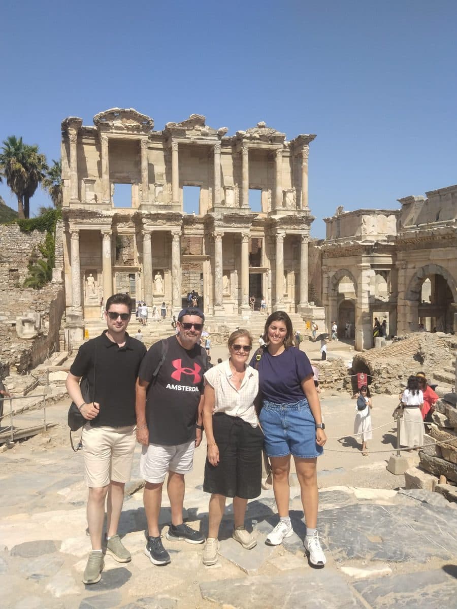 Four guests from the MSC Divina standing together in front of the Library of Celsus on a private Ephesus tour, 27 July 2026
