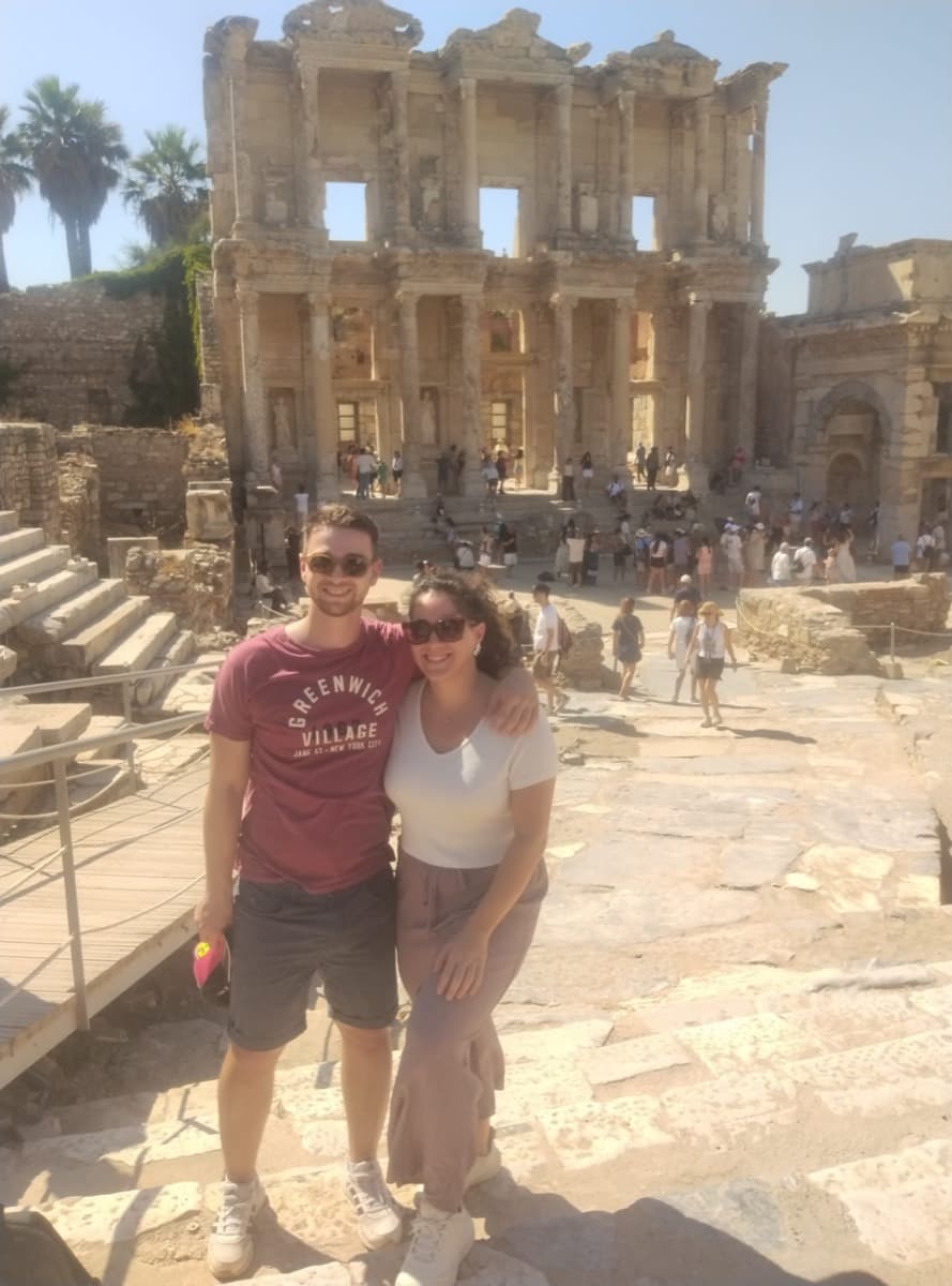 A couple from Norwegian Viva above the marble plaza of the Library of Celsus on a private Ephesus and Temple of Artemis tour from Kusadasi cruise port, 1 August 2026