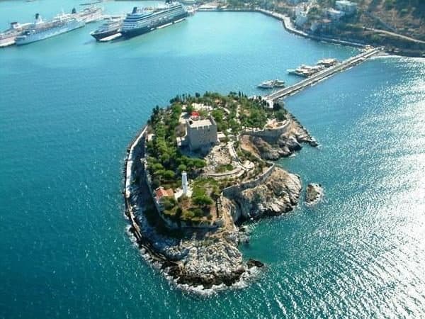 Güvercin Adası, Bird Island, joined to the Kuşadası shore by its 350-metre stone causeway, with the Byzantine castle above the water